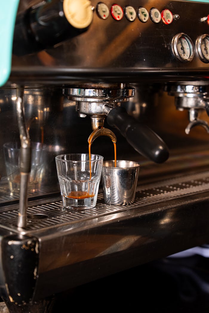 Close-up of an espresso machine pouring fresh coffee into a cup.